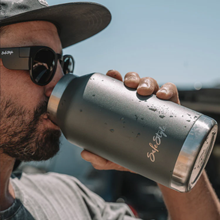 Dude drinking from a Big Juicy water bottle